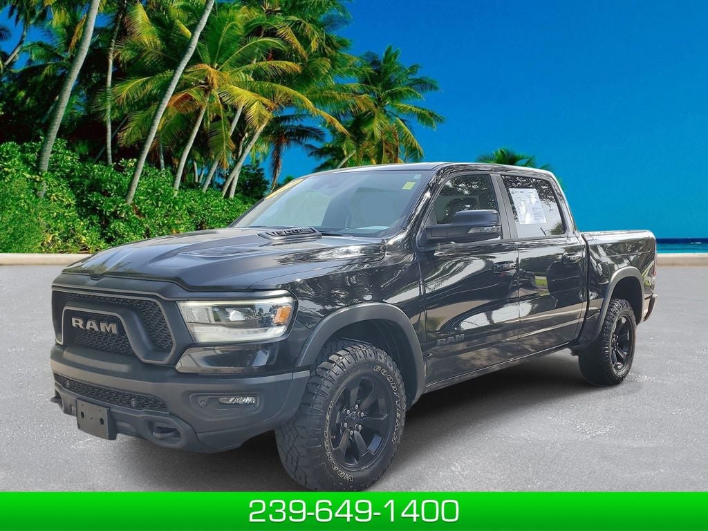 2024 RAM 1500 Rebel in Diamond Black Crystal Pearlcoat — front three-quarter view